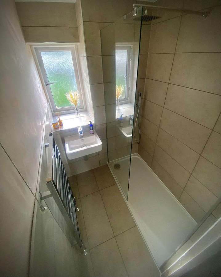 After — Family bathroom — strip-out to finished walk-in shower