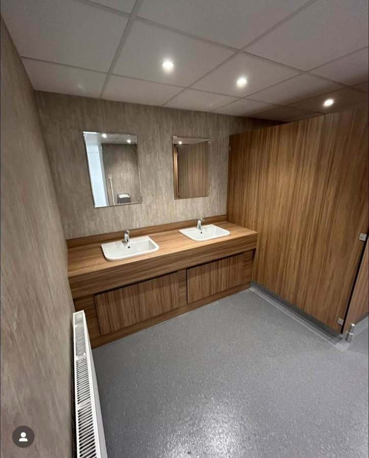 Commercial vanity run — twin basins & cubicles